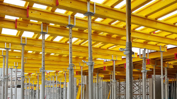 How do you adjust the height of a shoring jack?